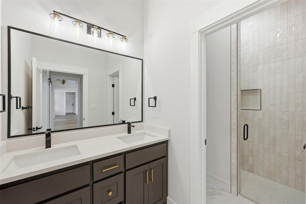 509 Emma Lane Grandview, TX 76050 - Photo 31 of 35 a bathroom with a double vanity sink and mirror