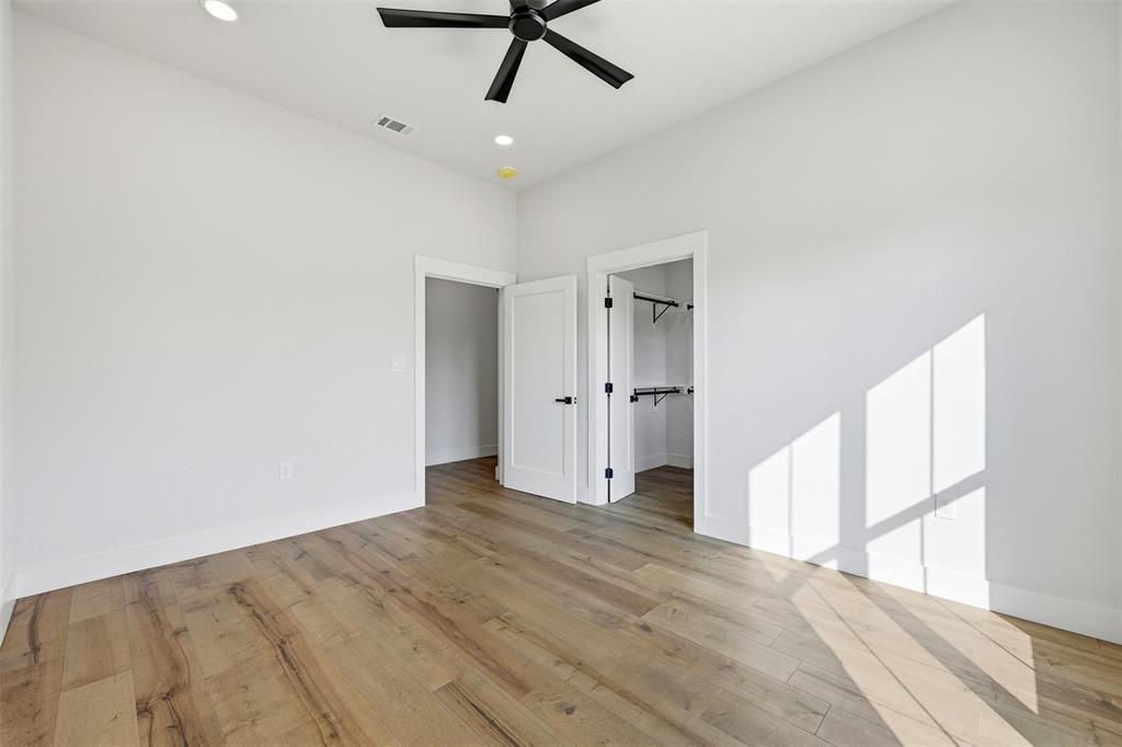 509 Emma Lane Grandview, TX 76050 - Photo 34 of 36 a view of empty room with wooden floor and fan