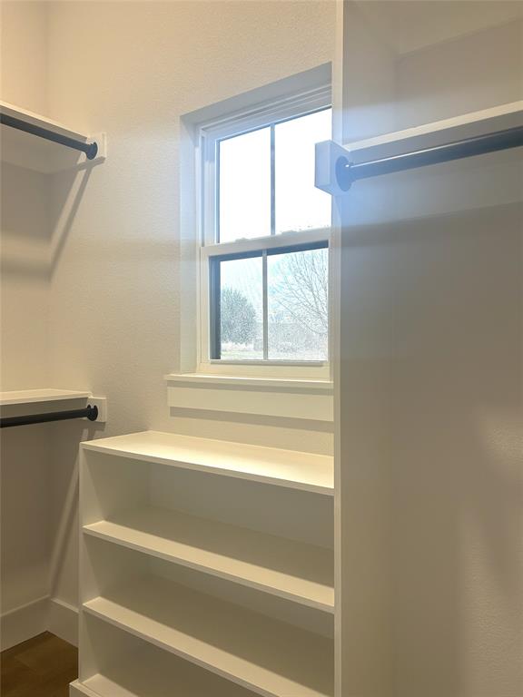 509 Emma Lane Grandview, TX 76050 - Photo 34 of 35 a bathroom with a bathtub and next to a window