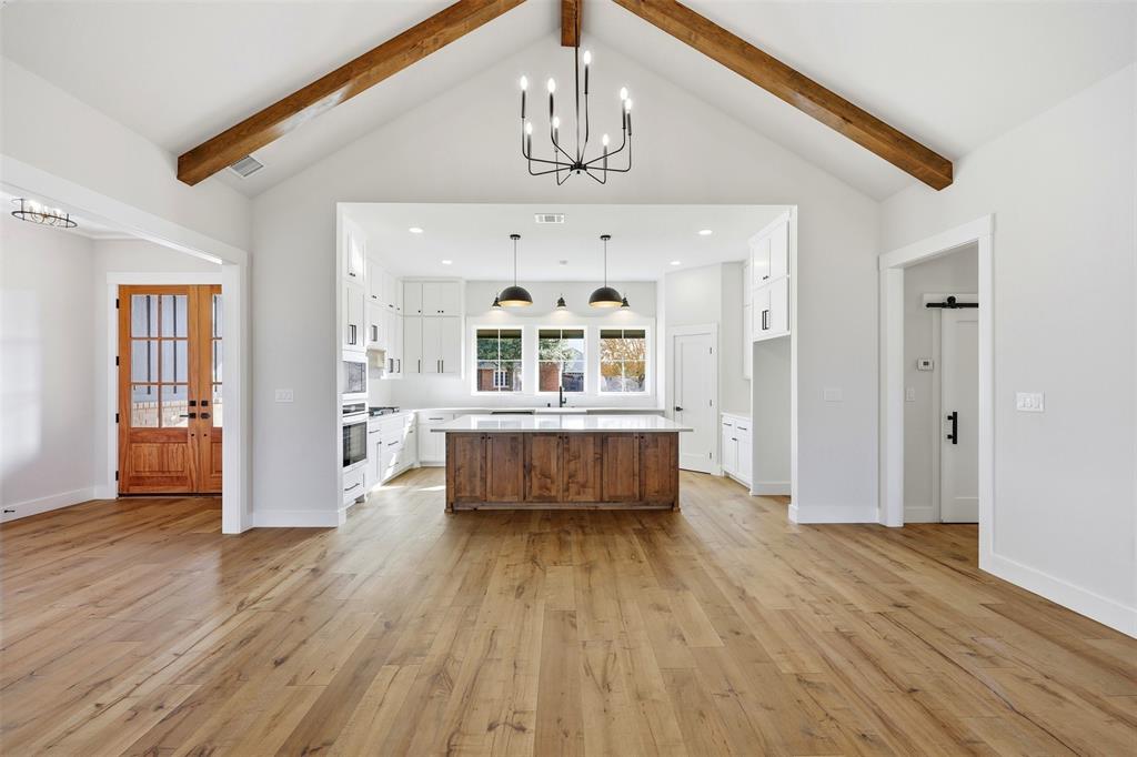509 Emma Lane Grandview, TX 76050 - Photo 10 of 35 a view of a living room and kitchen with wooden floor