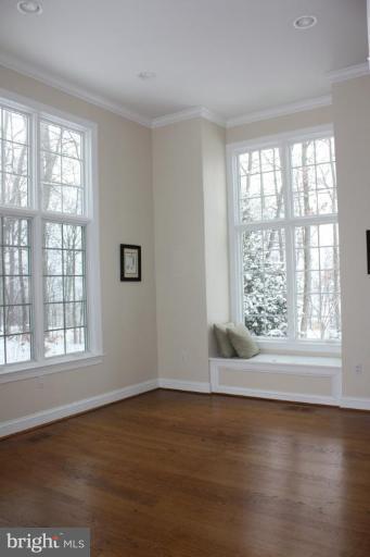2124 Dixon Road Frederick, MD 21704 - Photo 12 of 30 a view of an empty room with wooden floor and a window