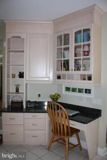 2124 Dixon Road Frederick, MD 21704 - Photo 18 of 30 a kitchen with stainless steel appliances a table chairs and a window