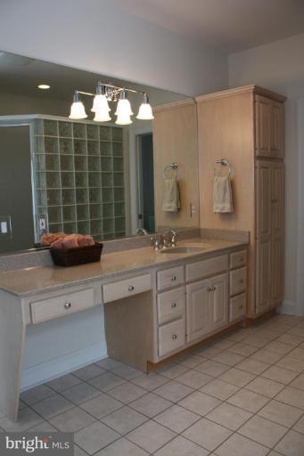 2124 Dixon Road Frederick, MD 21704 - Photo 22 of 30 a kitchen with a sink and large mirror