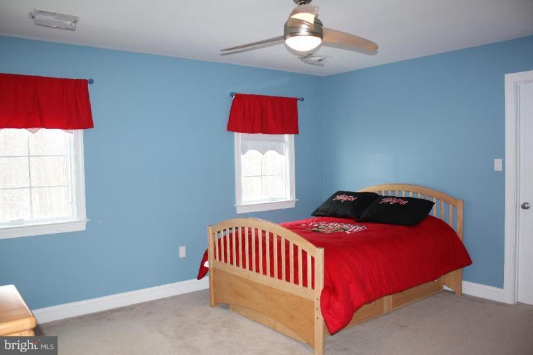2124 Dixon Road Frederick, MD 21704 - Photo 23 of 30 a bedroom with a bed and a window