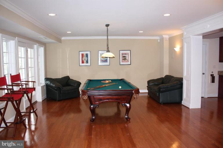 2124 Dixon Road Frederick, MD 21704 - Photo 25 of 30 a living room with furniture and a chandelier