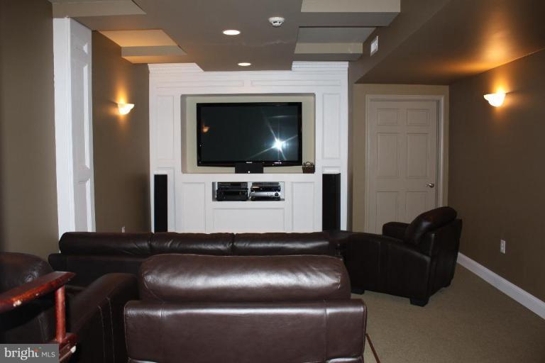 2124 Dixon Road Frederick, MD 21704 - Photo 27 of 30 a living room with furniture and a flat screen tv