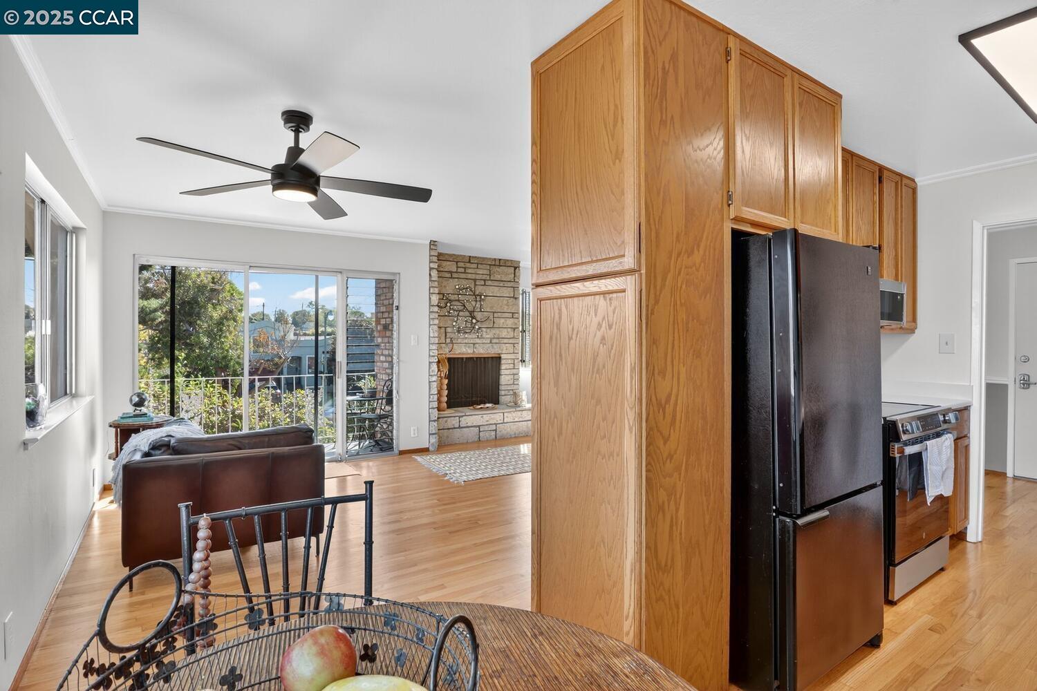 1601 Broadway, Unit 9 Alameda, CA 94501 - Photo 13 of 30 a kitchen with stainless steel appliances granite countertop a refrigerator a stove and a dining table