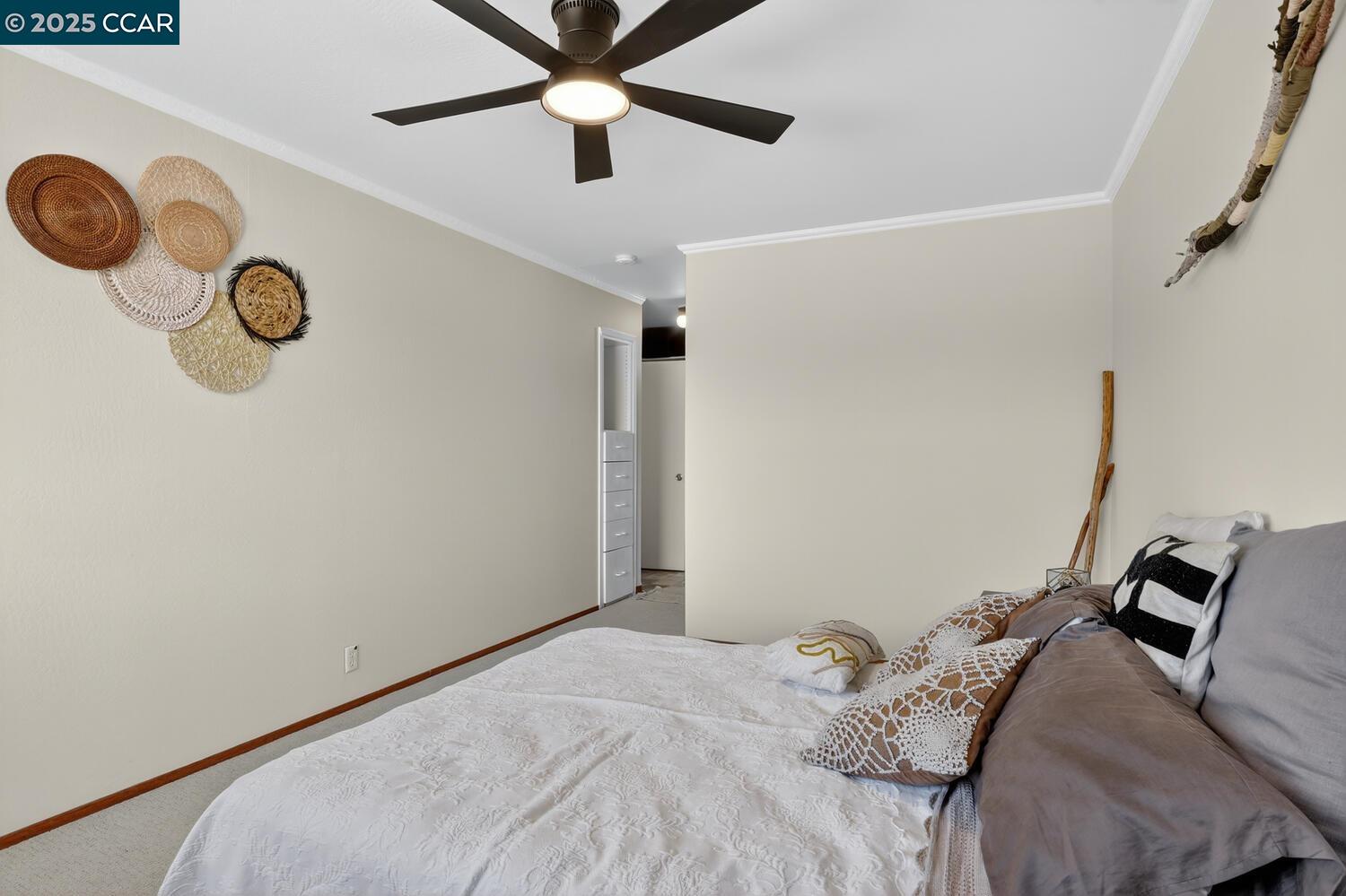 1601 Broadway, Unit 9 Alameda, CA 94501 - Photo 21 of 30 a bedroom with a bed and a chandelier
