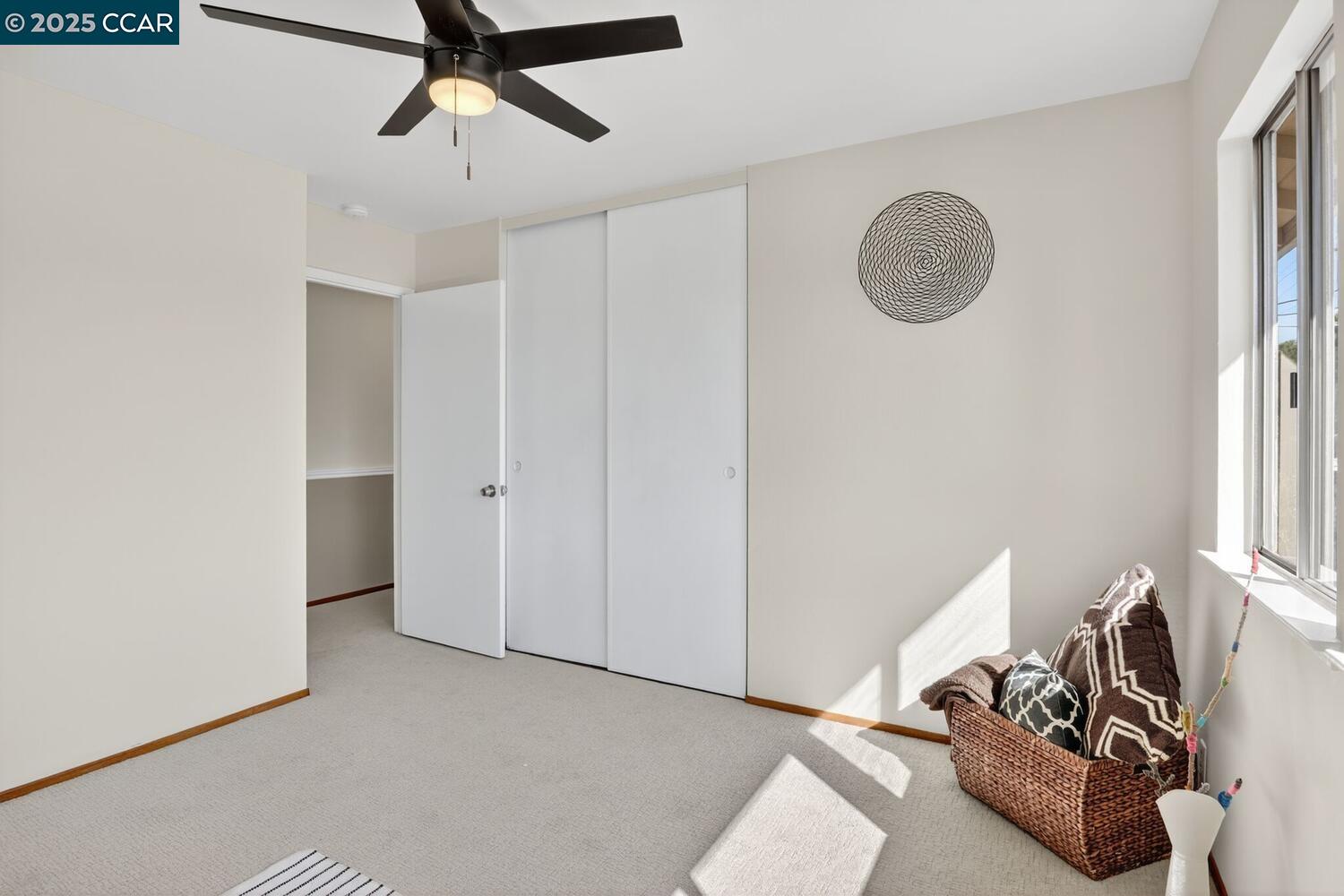 1601 Broadway, Unit 9 Alameda, CA 94501 - Photo 24 of 30 a view of a livingroom with a staircase and a projector
