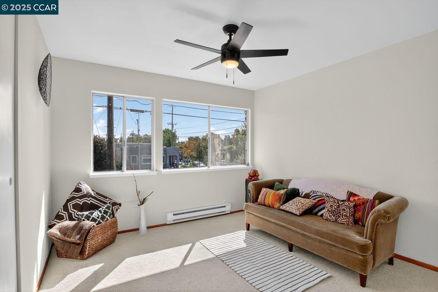 1601 Broadway, Unit 9 Alameda, CA 94501 - Photo 26 of 30 a living room with furniture and a window