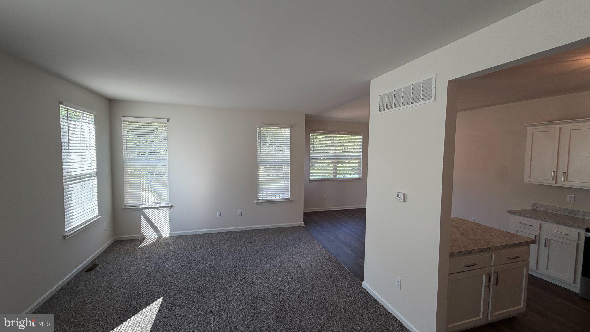 78 Tansboro Road Berlin, NJ 08009 - Photo 11 of 41 a view of an empty room with wooden floor and a window