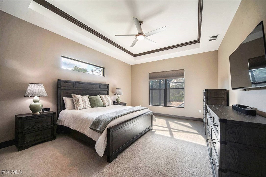6142 Calusa Rdg Trail Bokeelia, FL 33922 - Photo 12 of 43 a bedroom with a bed window and a desk