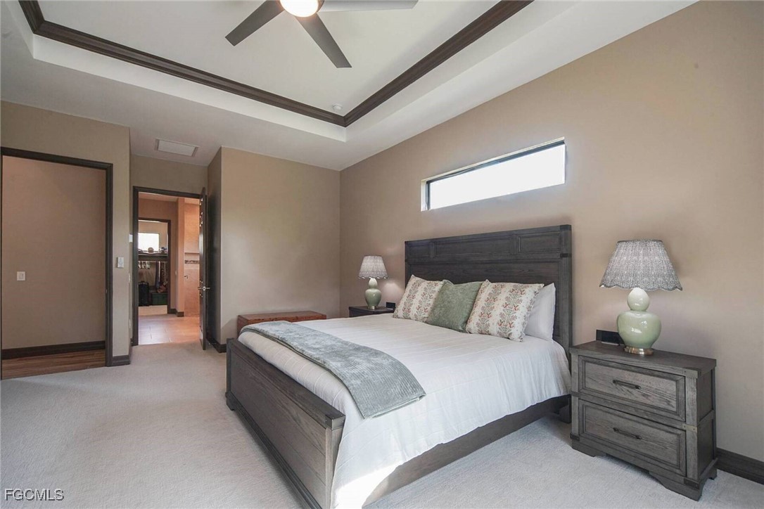 6142 Calusa Rdg Trail Bokeelia, FL 33922 - Photo 13 of 43 a bedroom with bed and window