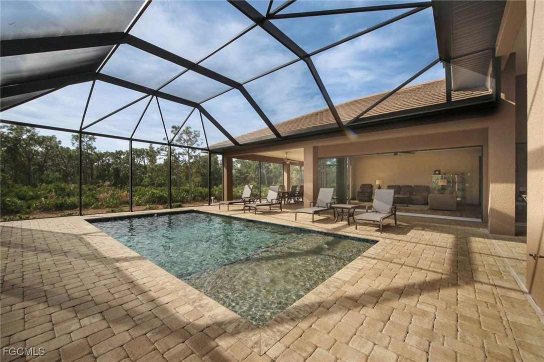 6142 Calusa Rdg Trail Bokeelia, FL 33922 - Photo 23 of 43 a view of a swimming pool with a patio