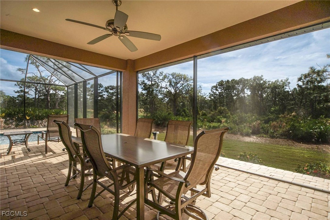6142 Calusa Rdg Trail Bokeelia, FL 33922 - Photo 25 of 43 a dining room with furniture and yard