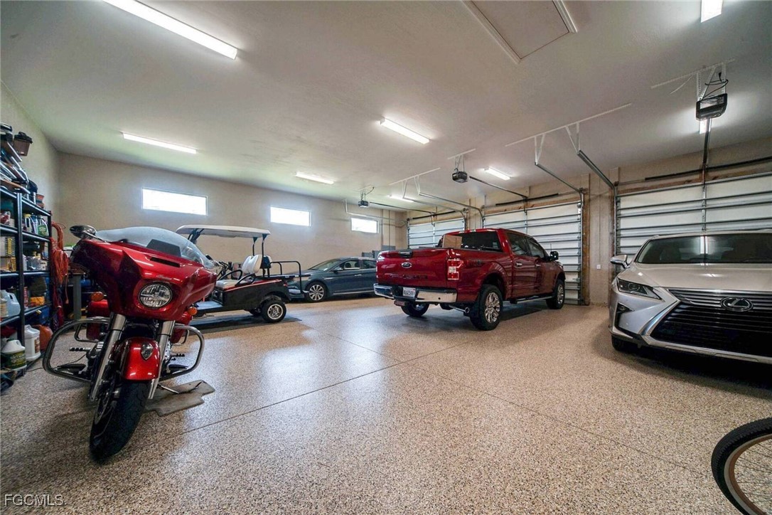 6142 Calusa Rdg Trail Bokeelia, FL 33922 - Photo 29 of 43 a view of a garage with cars