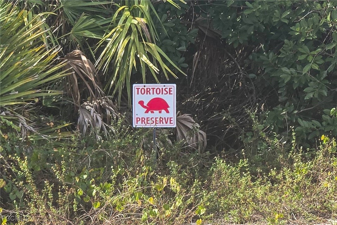 6142 Calusa Rdg Trail Bokeelia, FL 33922 - Photo 33 of 43 a sign that is on a brick wall