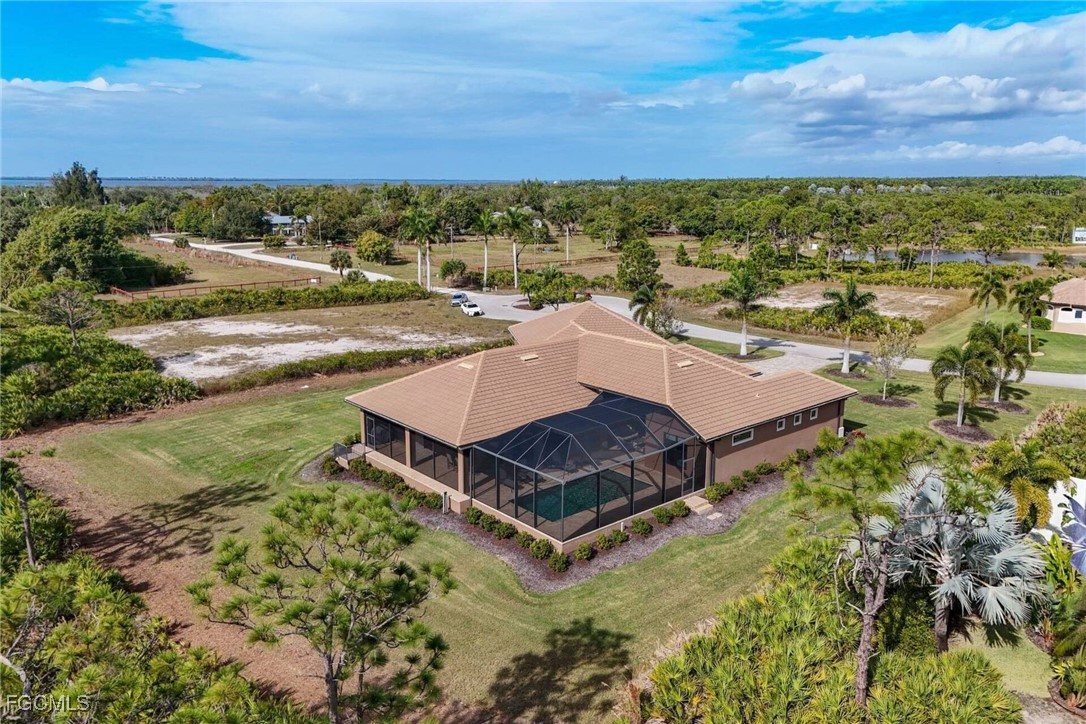 6142 Calusa Rdg Trail Bokeelia, FL 33922 - Photo 35 of 43 an aerial view of a house with a yard and lake view