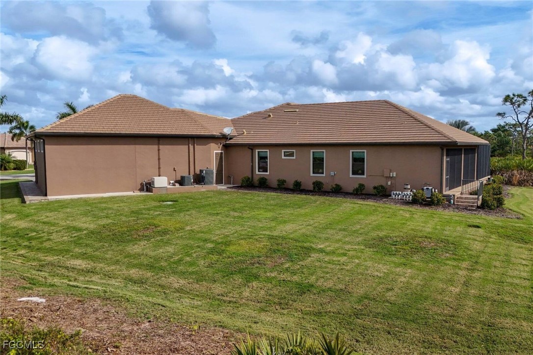 6142 Calusa Rdg Trail Bokeelia, FL 33922 - Photo 36 of 43 a front view of a house with garden