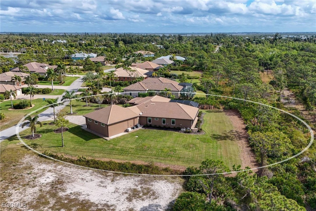 6142 Calusa Rdg Trail Bokeelia, FL 33922 - Photo 38 of 43 an aerial view of a house with a yard