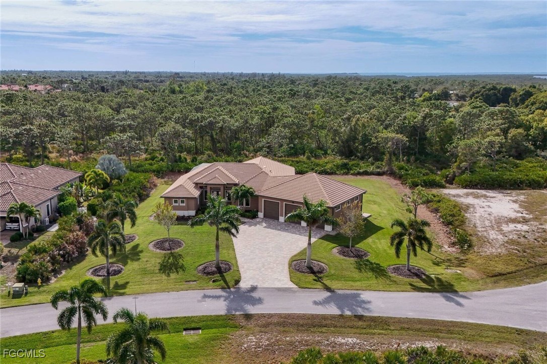 6142 Calusa Rdg Trail Bokeelia, FL 33922 - Photo 39 of 43 an aerial view of a house with a yard