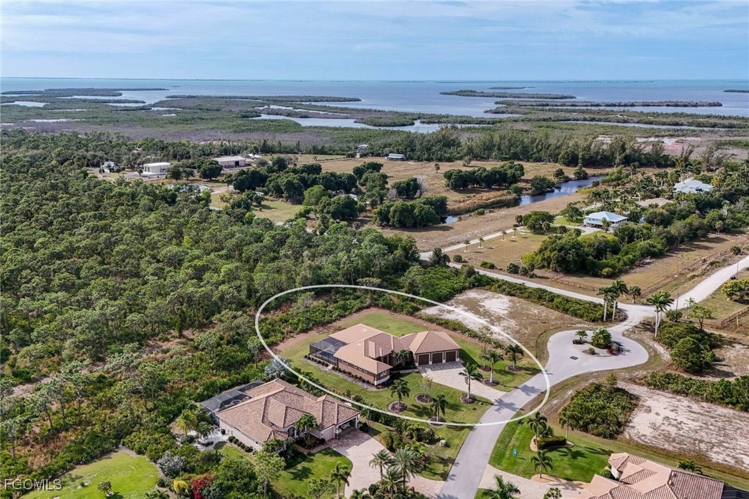 6142 Calusa Rdg Trail Bokeelia, FL 33922 - Photo 40 of 43 an aerial view of a city and mountain view in back