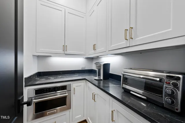 a spacious bathroom with a sink double vanity and a bathtub