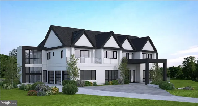 a front view of a house with a yard and trees