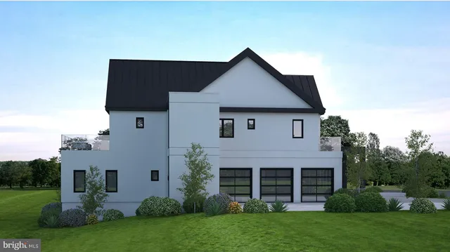 a view of a house with a yard and potted plants