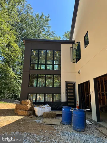 a view of a patio with couches chairs and potted plants