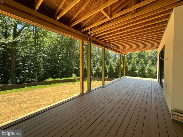 a view of a backyard with wooden floor