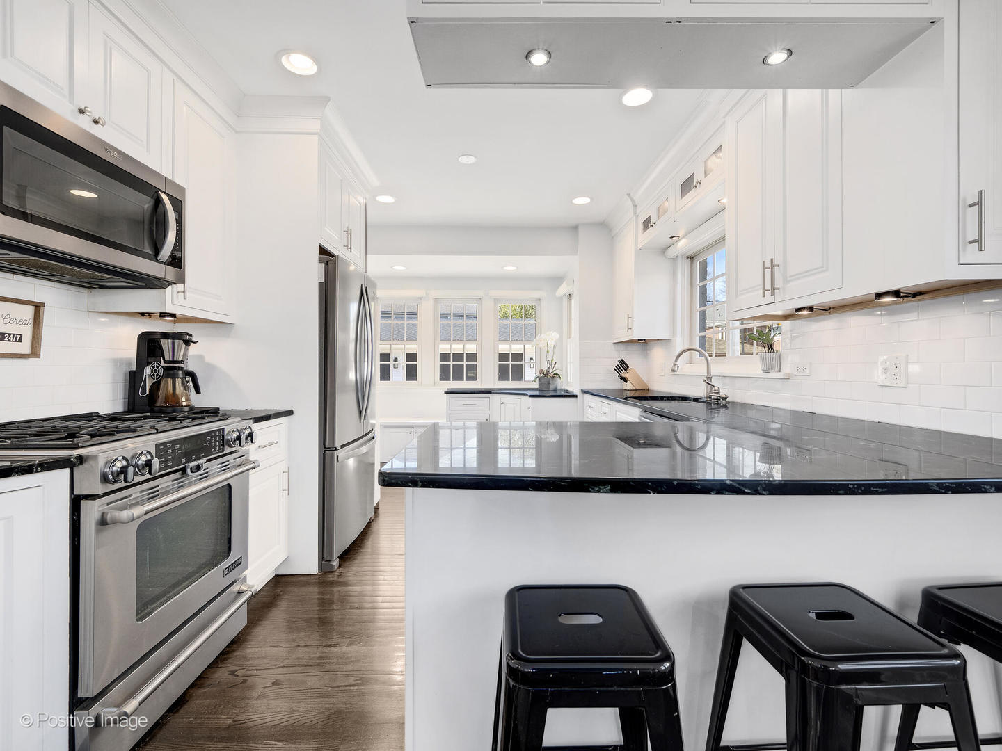 170 South Fairview Avenue Elmhurst, IL 60126 - Photo 12 of 37 a kitchen with stainless steel appliances granite countertop a stove top oven a sink a dining table and chairs