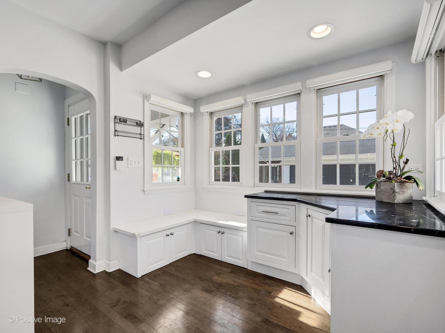 170 South Fairview Avenue Elmhurst, IL 60126 - Photo 17 of 37 a kitchen with granite countertop white cabinets and white appliances