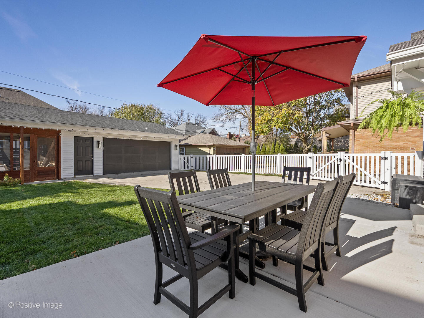 170 South Fairview Avenue Elmhurst, IL 60126 - Photo 30 of 37 a patio with a table and chairs under an umbrella