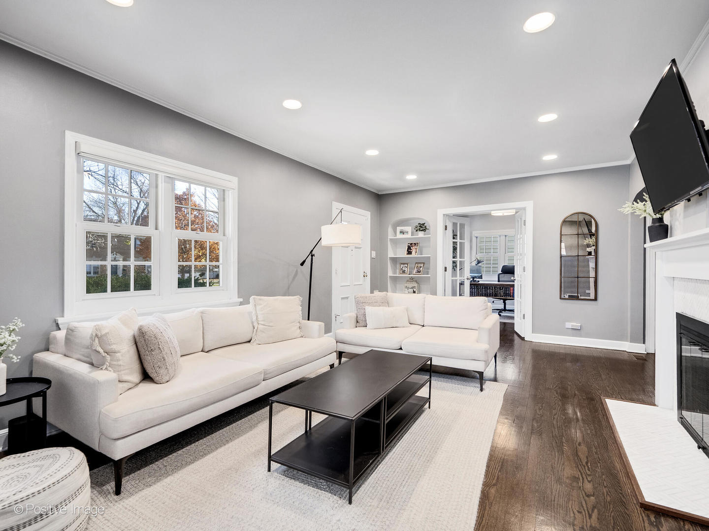 170 South Fairview Avenue Elmhurst, IL 60126 - Photo 5 of 37 a living room with furniture a flat screen tv and a large window