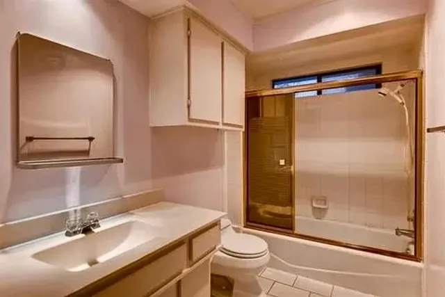 an empty room with a ceiling fan