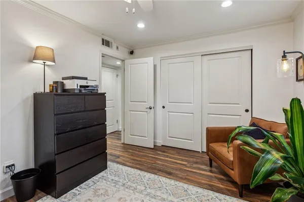 a living room with furniture and a lamp