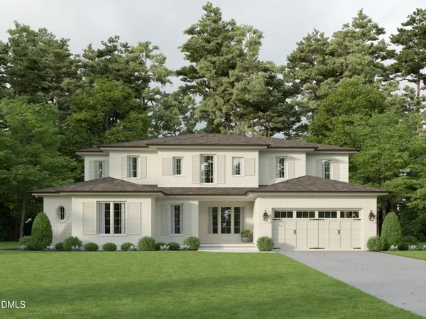 a front view of a house with a garden and plants