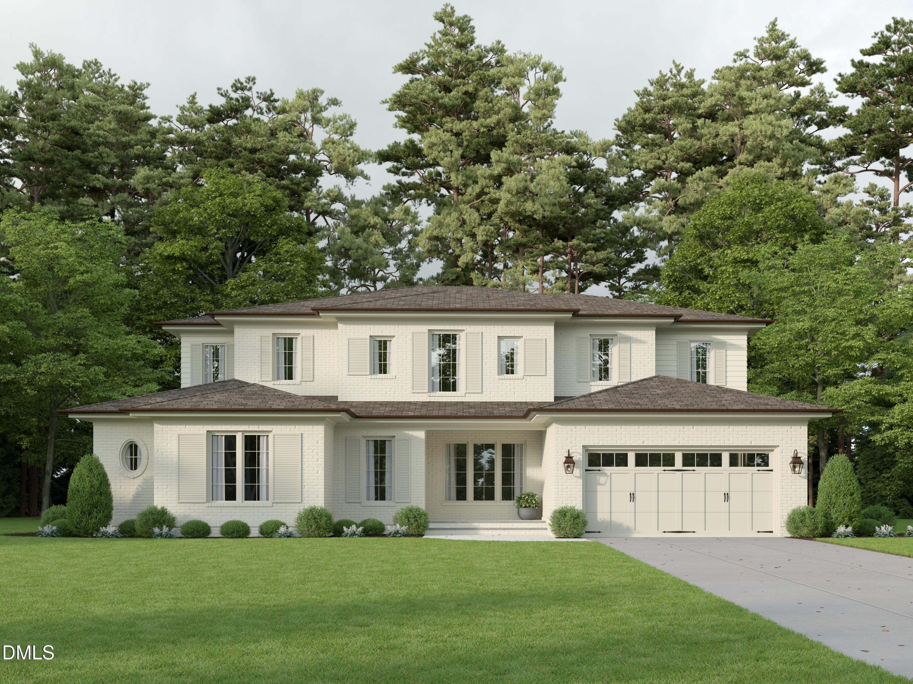 a front view of a house with a garden and plants