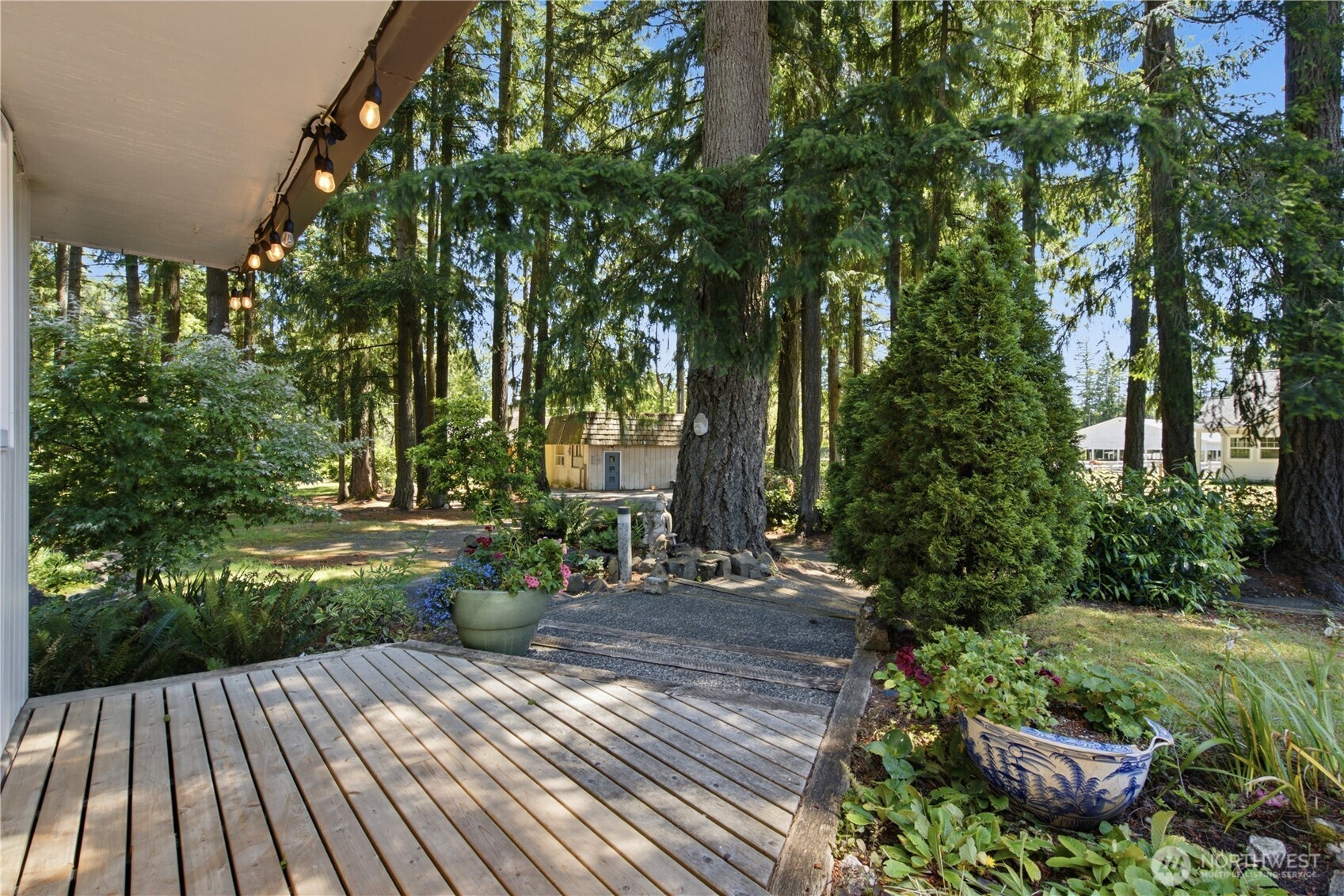 3050 Southeast Mullenix Road Port Orchard, WA 98367 - Photo 27 of 40 a view of a backyard with sitting area
