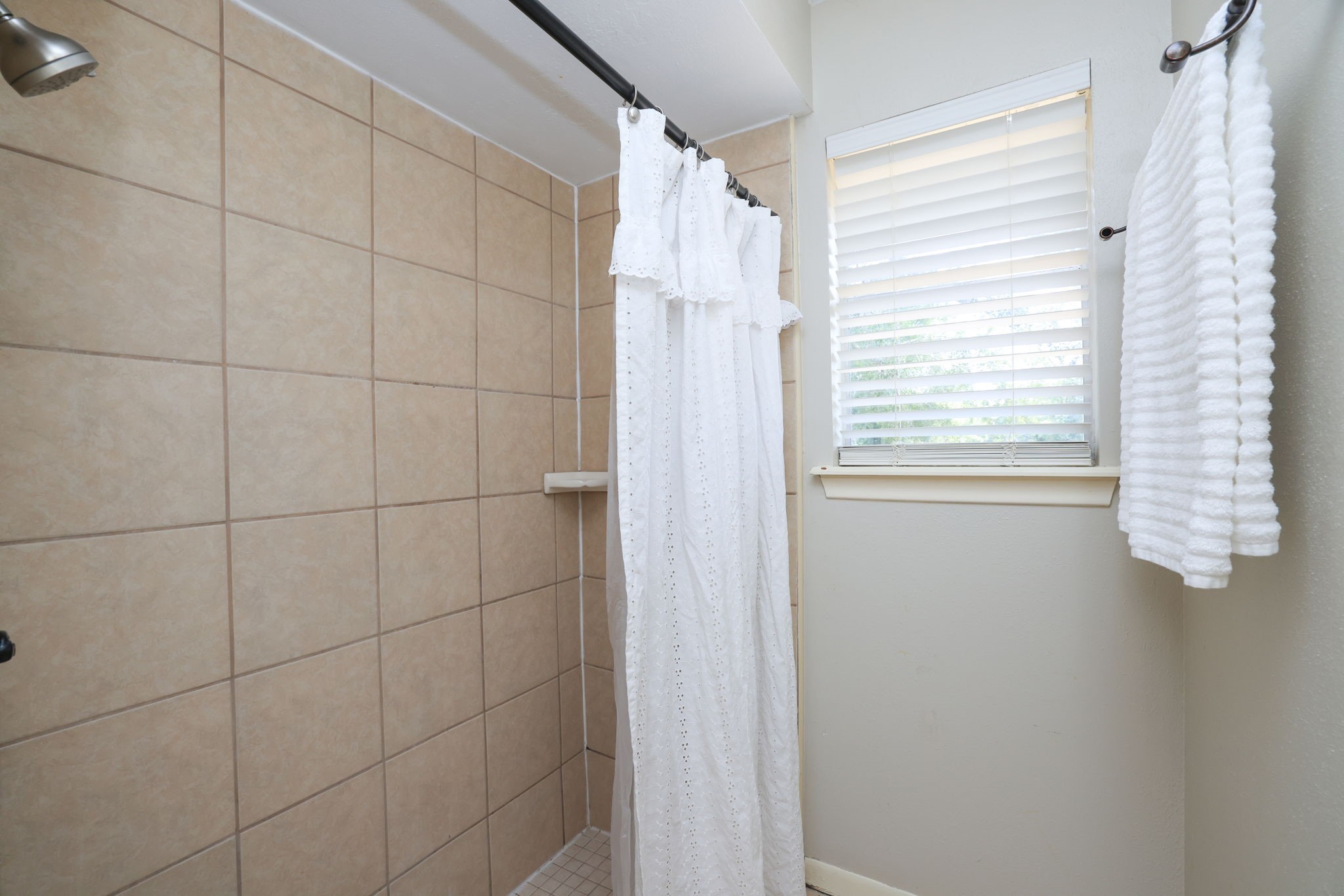 22010 Buescher Road Tomball, TX 77377 - Photo 12 of 30 a bathroom with a shower