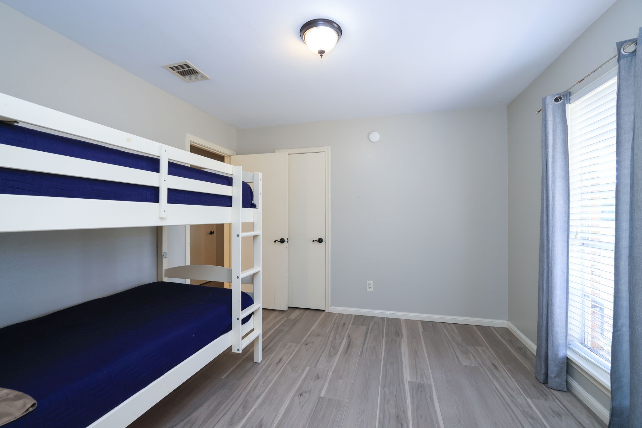 22010 Buescher Road Tomball, TX 77377 - Photo 14 of 30 a view of room with wooden floor and window