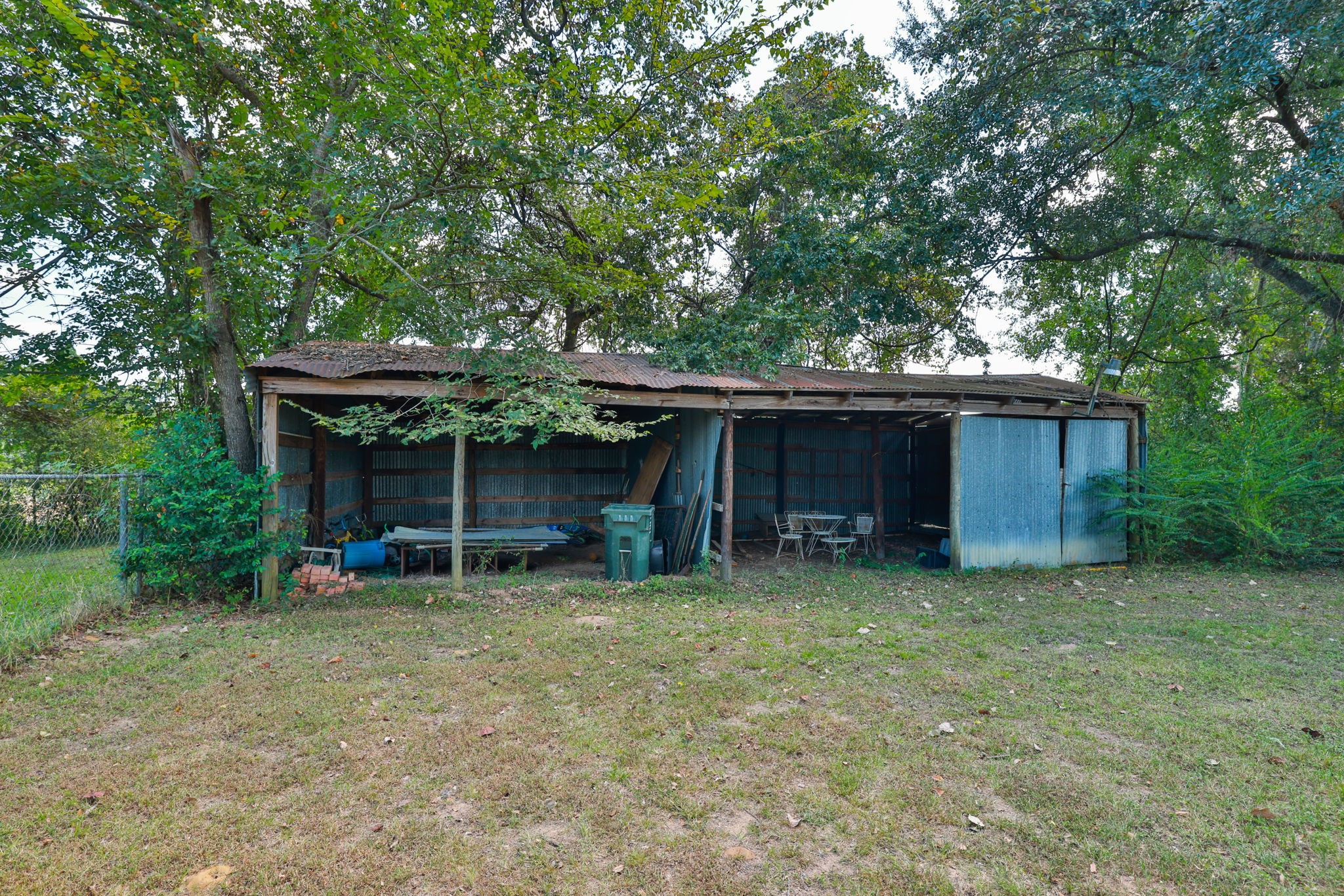 22010 Buescher Road Tomball, TX 77377 - Photo 24 of 30 a view of a house with a yard and sitting area