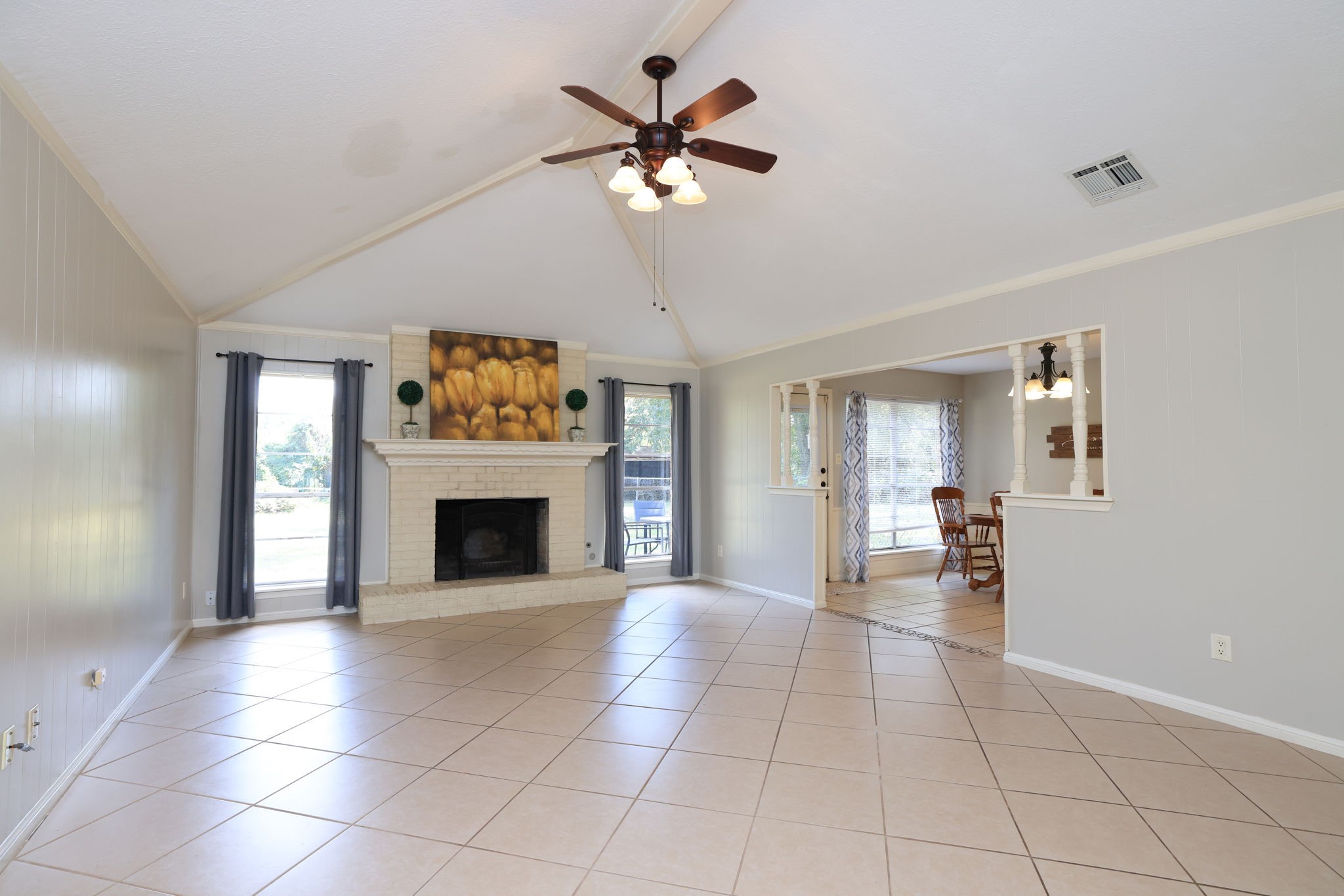 22010 Buescher Road Tomball, TX 77377 - Photo 5 of 30 a view of a livingroom with a fireplace and a chandelier fan