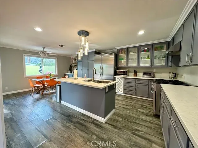 a kitchen with a sink and cabinets
