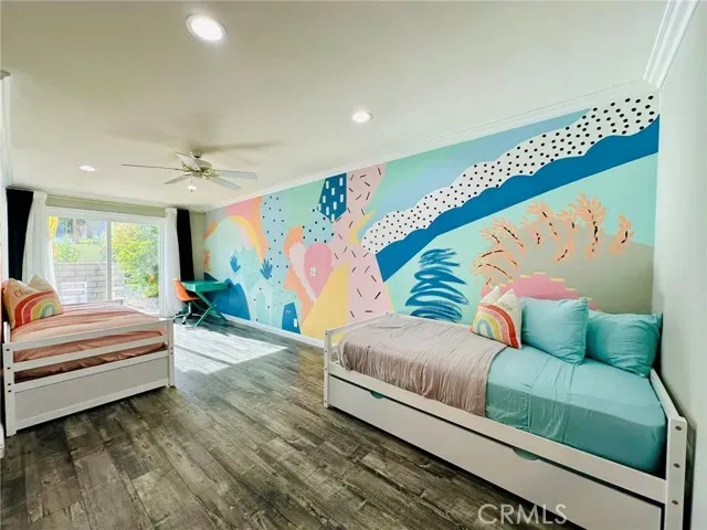 a bedroom with a bed and a couch