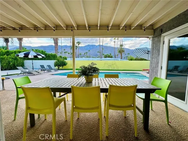 a view of an chairs and table in patio