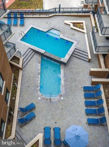 a view of a backyard with plants and a table