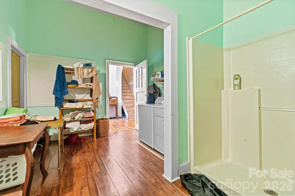 a view of a livingroom with furniture and hardwood floor