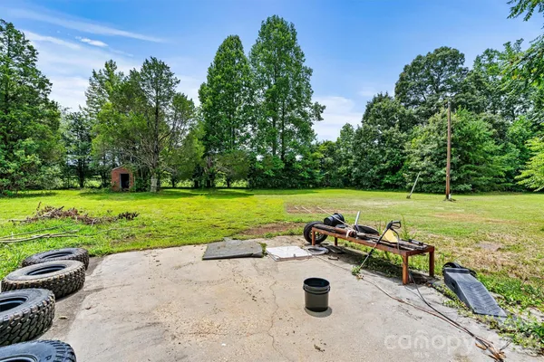 an outdoor space with furniture and garden